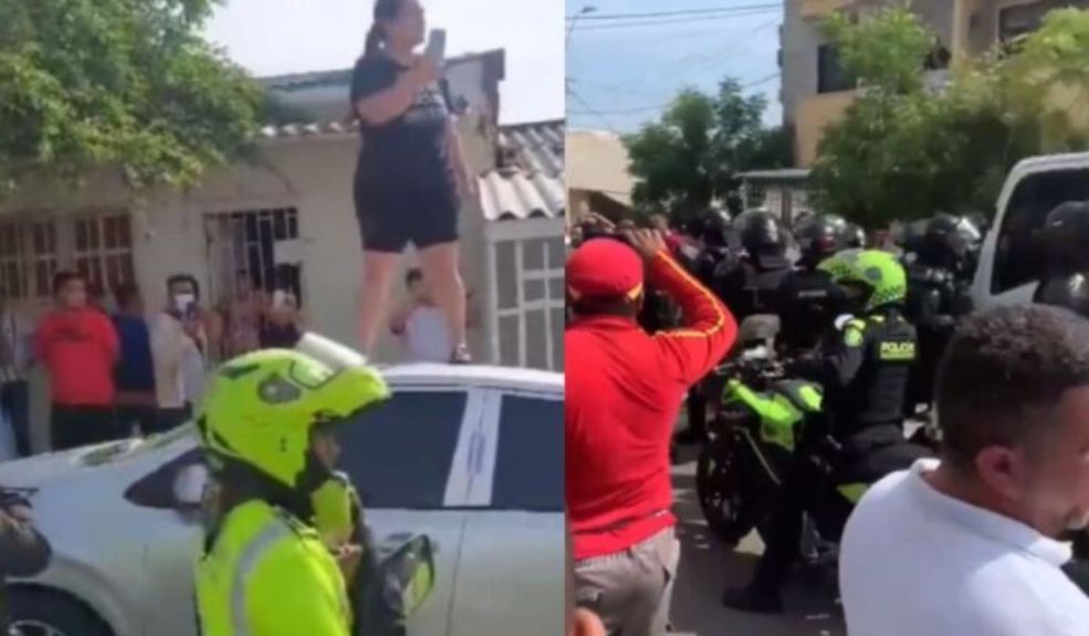 EN VIDEO: Mujer se subió al techo de su carro para que la Policía no lo inmovilizara Las autoridades tuvieron que intervenir para controlar la situación y obligar a la mujer a descender del carro.
